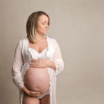 beautiful pregnant woman wearing white by norfolk maternity photographer