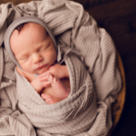 newborn baby boy wrapped in grey by newborn photographer norfolk