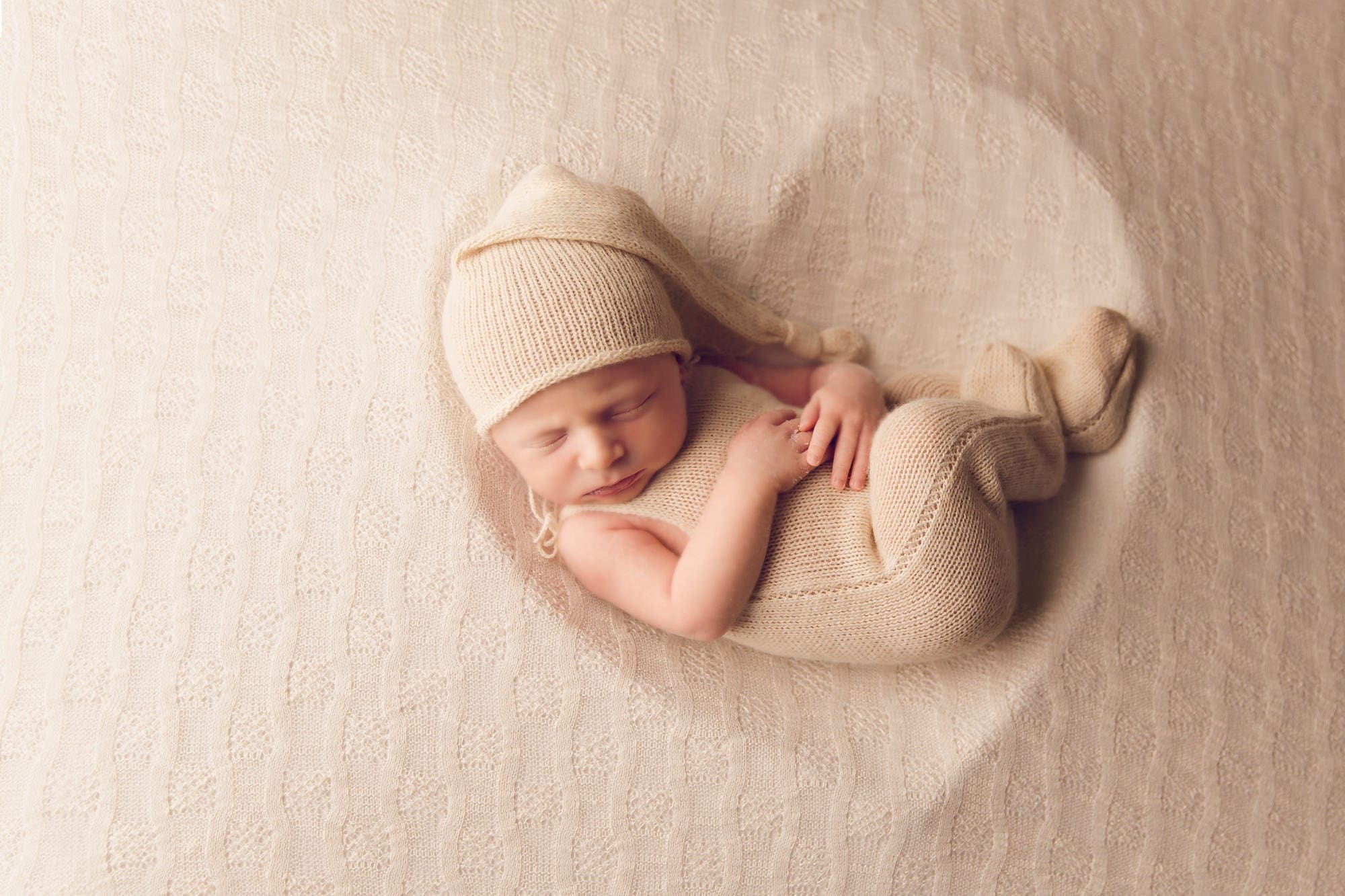Beautiful Newborn baby boy posed in a heart bowl by newborn photographer in Norfolk